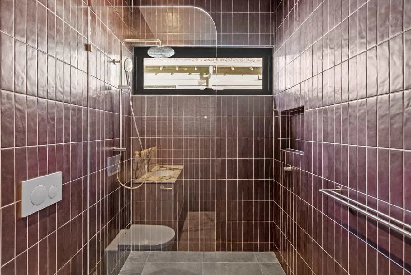 Bathroom renovation with tiled shower and concealed plumbing