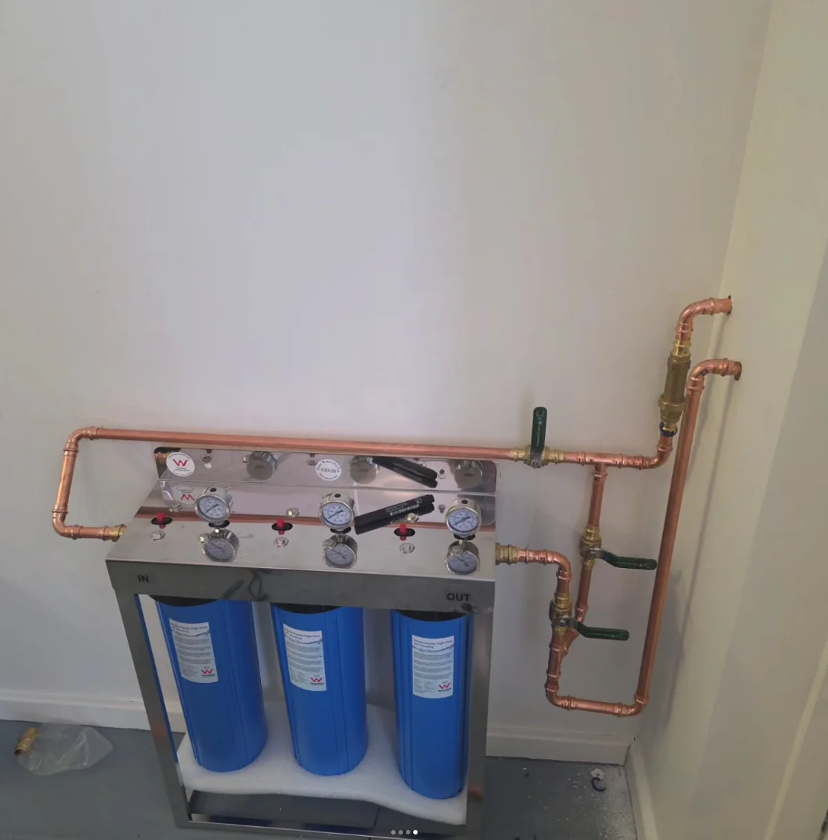 Three-stage water filtration system with sediment canisters